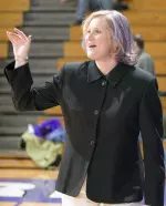 Head Coach Beth Combs sports her new purple do at Sunday's game. Combs was dared to dye her hair purple if there were 3,000 pre-sold tickets to the game.