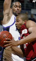 Northwestern's Sterling Williams, left, guards Stanford's Fred Washington during the first half. (AP Photo/Nam Y. Huh)