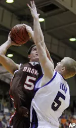 Brown's Scott Friske goes up for a shot against Jeff Ryan during the first half. (AP Photo/Jerry Lai)
