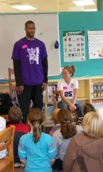 Sterling Williams and Ali Schneeman read for students at McKenzie Elementary School.