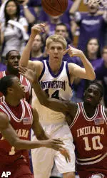 Kevin Coble battles Indiana's Armon Bassett (1) and Roderick Wilmont (10) for a loose ball during the first half Wednesday night in Evanston.