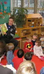 Young kids enjoy storytime with Northwestern student-athletes at School for Little Children