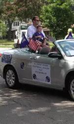Pat Fitzgerald and his son Jack at the Evanston 4th of July Parade.