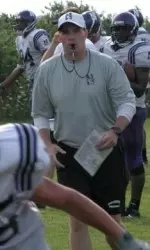 Coach Fitzgerald watches his team go through the Hamburger Drill during Saturday morning's practice in Kenosha, Wis.