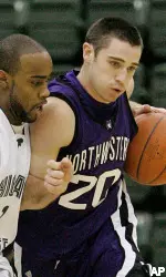 Craig Moore brings the ball up the floor during the first half.