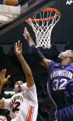 Illinois' Brian Randle shoots for the basket as Northwestern's Sterling Williams defends in first half.