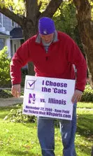Joel Belding of the Wildcat Football Team hit the streets of Evanston to deliver more than 50 yard signs last week.