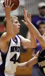 Northwestern's Kevin Coble, left, looks to pass the ball around Purdue's Robbie Hummel during the first half (AP Photo)