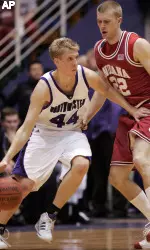 Northwestern's Kevin Coble, left, drives to the basket against Indiana's Lance Stemler during the first half (AP Photo)