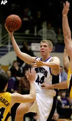 Northwestern's Kevin Coble (44) goes up for a shot as Minnesota's Blake Hoffarber (24) and Spencer Tollackson defend during the second half (AP Photo)