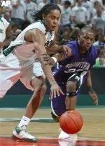 Michigan State's Chris Allen, left, and Northwestern's Jeremy Nash chase after a loose ball during the second half of a basketball game Saturday, Feb. 9, 2008, in East Lansing, Mich. Michigan State won 70-55. (AP Photo/Al Goldis)