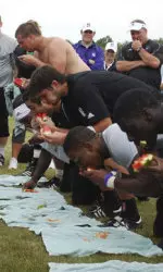 The Wildcats get after it during their annual Camp Kenosha watermelon eating contest.