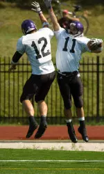 Freshman wide receiver Jeremy Ebert celebrates with teammate Andrew Brewer after his 56-yard touchdown catch.