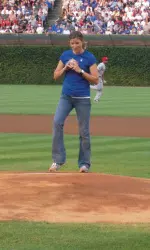 Head coach Kelly Amonte Hiller threw a strike in the ceremonial first pitch.