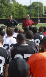 Former Wildcat Jack Rudnay speaks to the squad on the first day of practice