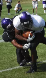 Senior Rasheed Ward catches a pass during live 11-on-11 action Saturday morning.
