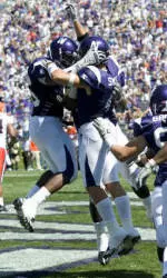 NU celebrates Brendan Smith's interception for TD on Saturday.