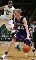 Kevin Coble drives past Michigan State's Delvon Roe during the first half. Coble netted 31 points in the upset.(AP Photo/Al Goldis)
