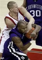 Wisconsin's Kevin Gullikson, top, battles with Northwestern's Jeremy Nash during the first half of an NCAA college basketball game Wednesday, Jan. 7, 2009, in Madison, Wis. (AP Photo/Andy Manis)