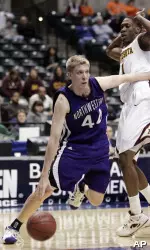 Kevin Coble drives past Minnesota guard Al Nolen during the first half. (AP Photo/Michael Conroy)