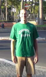 Nick Fruendt poses for a photo near a park next to the team's hotel in Rome.
