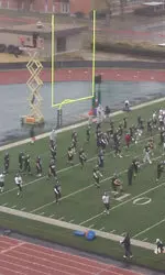 Northwestern held its first Dallas-area workout on a rain-soaked field Tuesday.