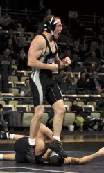 Levi Mele won his 141-pound match over Michigan's Mark Weber in sudden victory on Sunday.