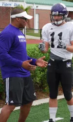 Lou Ayeni coaching Jeremy Ebert at a practice in Tampa in preparation for the 2010 Outback Bowl.