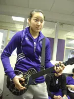 Stacey Lee shows off her skills on Guitar Hero.