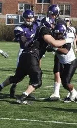 Jack DiNardo (left, black jersey) is trying to earn a starting spot at one of the Wildcats' defensive tackle positions this year.