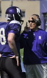 Quarterbacks coach Mick McCall instructs redshirt freshman signal-caller Evan Watkins Saturday afternoon.
