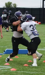 Linebacker Bryce McNaul (black jersey) eventually won this rep in Tuesday's blitz pickup drill in Camp Kenosha.