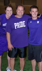 A member of the Evanston Fire Department with several student-athlete kickball teammates.