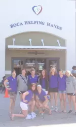 In between workouts on Wednesday, Dec. 19, Northwestern volunteered at Boca Helping Hands.