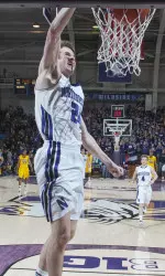 John Shurna throws down a dunk against Minnesota en route to becoming NU's all-time leading scorer.