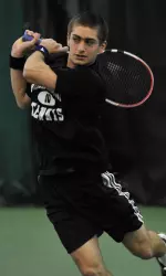 Spencer Wolf defeated 21st-ranked Roy Kalamanovich of Illinois in singles action Friday night.