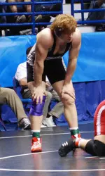 Redshirt freshman Mike McMullan assured himself All-America status at heavyweight, winning two bouts Friday evening.