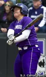 Adrienne Monka watches her home run Sunday against Ohio State travel onto the roof of McGaw Hall.