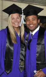Football's Jeravin Matthews and Madalyn Shalter of the volleyball team enjoy the Commencement festivities Friday.