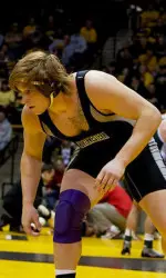 All-American heavyweight Mike McMullan and the Wildcats host six home duals and the 50th Midlands Championships at Welsh-Ryan Arena in 2012-13.