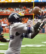 Demetrius Fields hauled in this pass in the corner of the end zone with 44 seconds remaining to help NU to a 42-41 win at Syracuse Saturday.