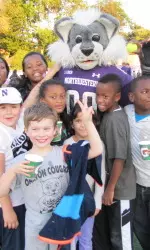 Field Day participants enjoy a day with Willie the Wildcat.