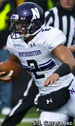 Kain Colter crossed the 2,000-yard mark for his career both passing and rushing Saturday at Iowa.