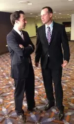Chris Collins (right) talks with Minnesota head coach Richard Pitino at the 2013 Big Ten Basketball Media Day.