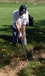 Bennett Lavin had to drop to his knees to escape this foot-wide bunker on the third hole Sunday at Erin Hills.