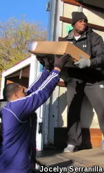 It may have been a bye week, but several NU football players got in a good lift distributing frozen chicken.