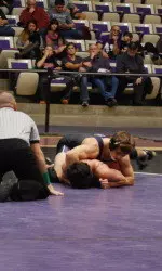 Jason Tsirtsis recorded two pins for the Wildcats Friday.