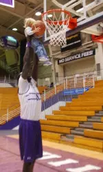 Chier Ajou helps a youngster reach the rim at last year's event.