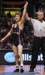 Senior Jason Welch has his hand raised after winning the 157-pound Big Ten Championship Sunday in Champaign.