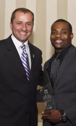 Venric Mark accepts his Jesse Owens Big Ten Male Athlete of the Year nomination from Jim Phillips at Thursday's N Club induction ceremony.
